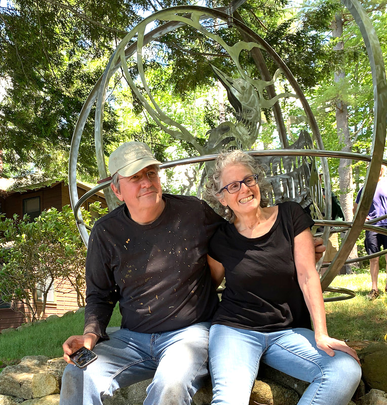 Leo and Kathryn after installing the loon sculpture. Photo by Tony Wagner