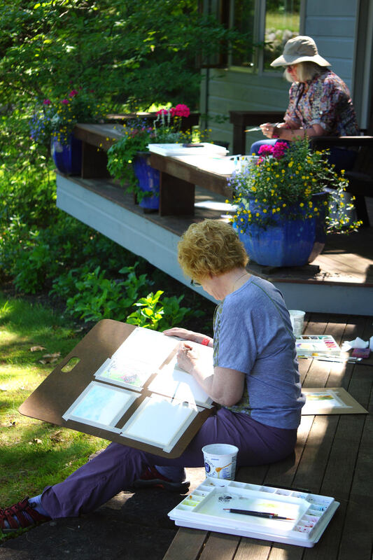 Students painting outdoors in the flower garden. Photo by Kathryn Field
