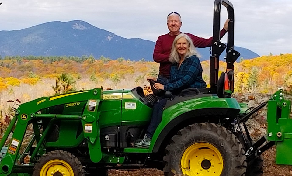 Green acres...no more high heels, now I drive a tractor. With Griff at our new home. Photo by Eileen Levesque.